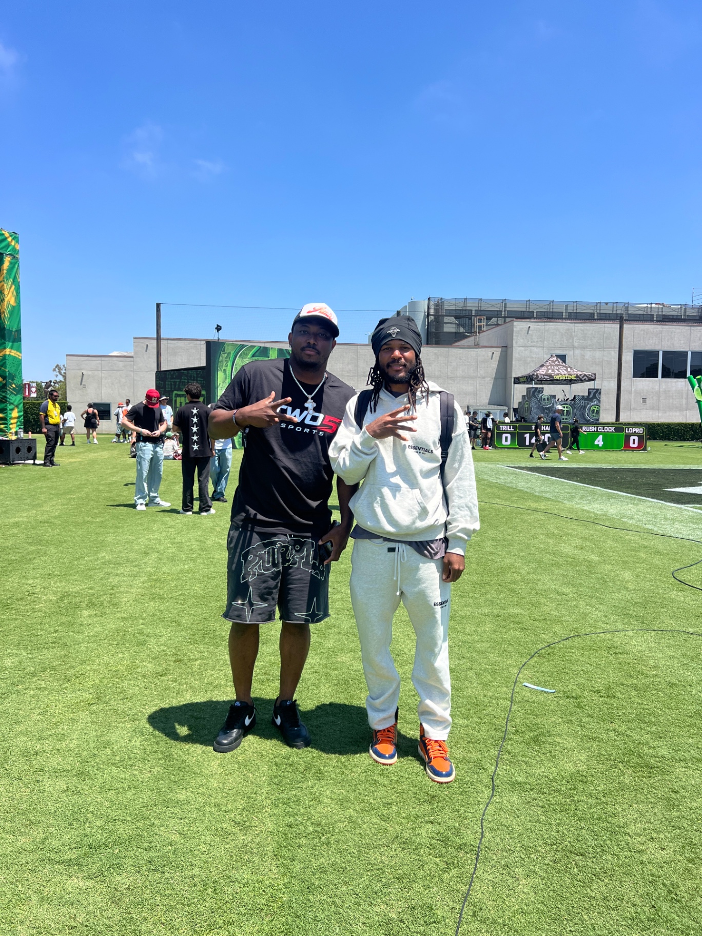 JB on the field covering athletes at a football event